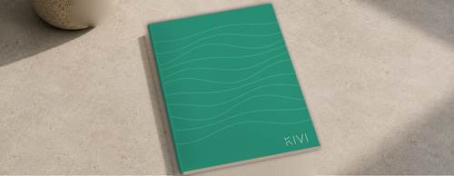 KIVI B6 stone paper notebook in Verdigris, lying on a stone table